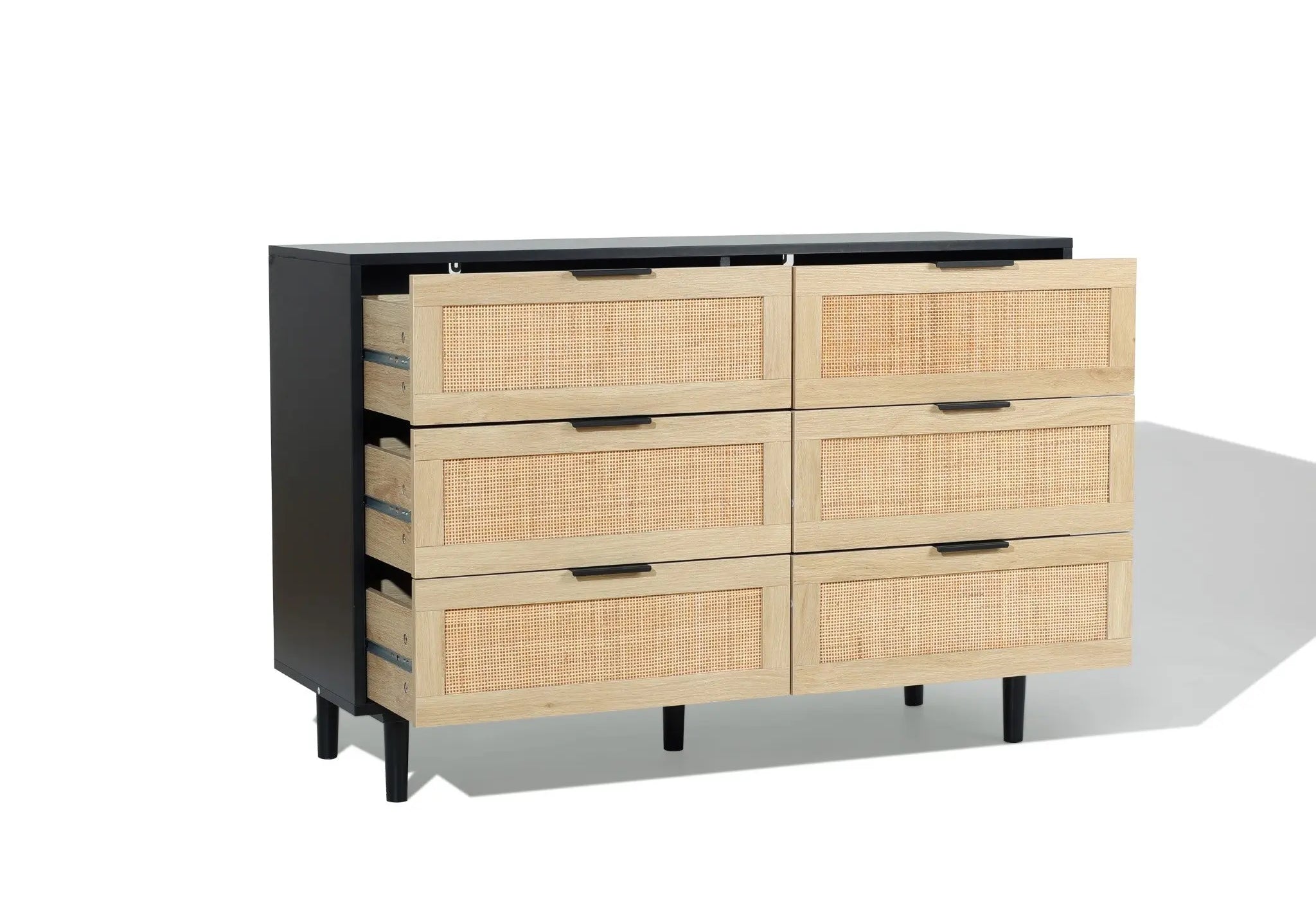 A six-drawer dresser with a black frame and light wood drawer fronts, two top drawers partially open, set against a plain white background.