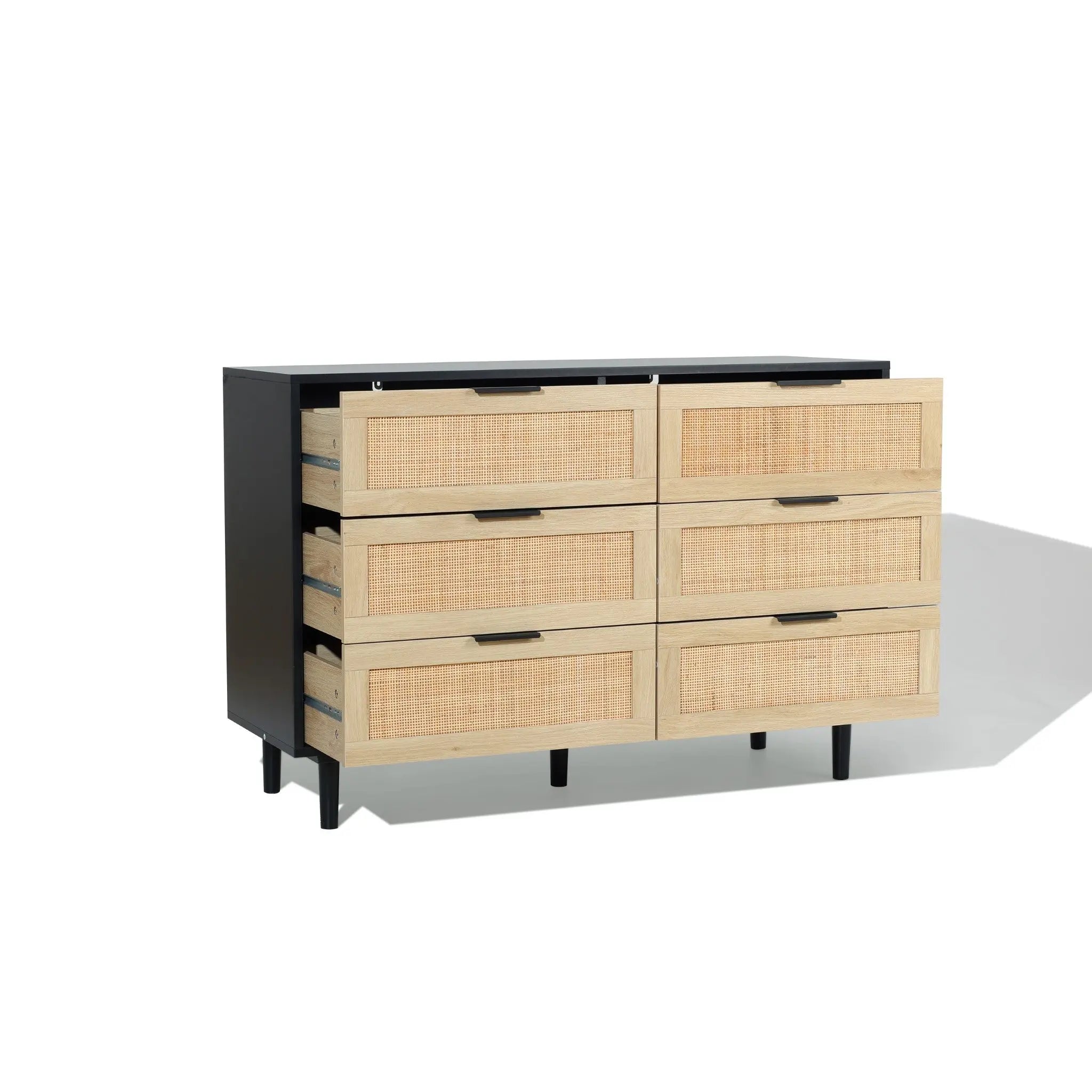 A six-drawer dresser with a black frame and light wood drawer fronts, two top drawers partially open, set against a plain white background.