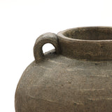 Close-up of the LuxenHome Rustic brown terracotta cauldron vase, 14.6 h, featuring a rough texture and a single looped handle near the rim. Set against a plain white background, this piece enhances any home decor with natural elegance.