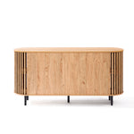 This mid-century modern buffet cabinet features slatted sides and sleek black legs. The front boasts a sliding door showcasing an oak wood grain finish, embodying both style and function.