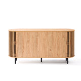 This mid-century modern buffet cabinet features slatted sides and sleek black legs. The front boasts a sliding door showcasing an oak wood grain finish, embodying both style and function.