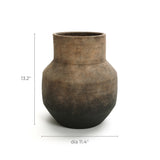 The LuxenHome Brown Ombre Terracotta Round Vase is a handcrafted ceramic piece with a vintage aesthetic, featuring a wide body and narrow neck. It has a light to dark brown gradient and measures 13.2 in height with an 11.4 diameter, making it the perfect decorative piece.