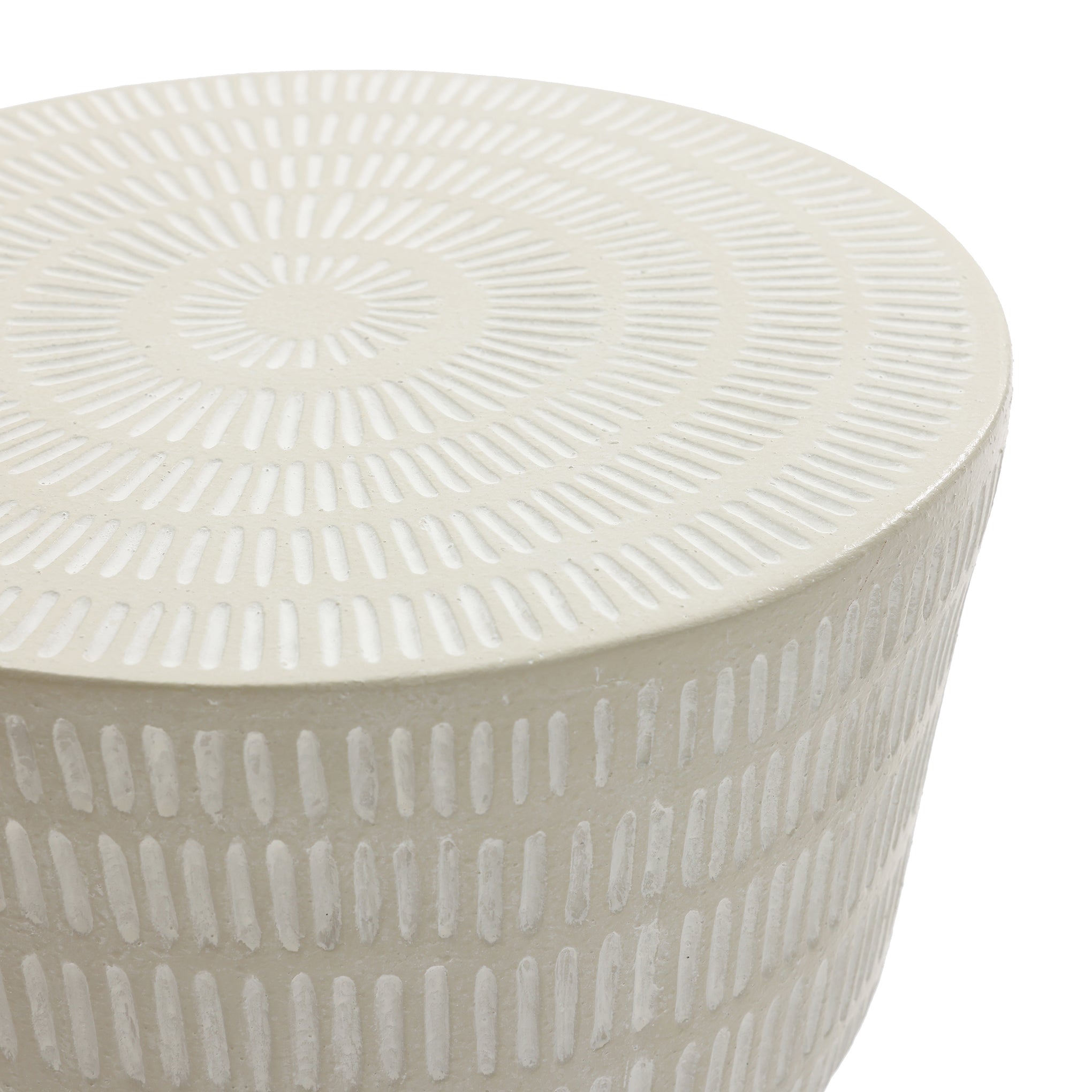 The LuxenHome Meru outdoor side table is a beige, round ceramic piece featuring a minimalist design with small, elongated dashes in concentric circles on the surface and vertical lines down the sides.