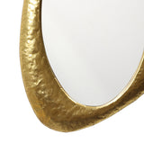 zoomed-in-image-highlighting-the-decorative-elements-of-a-gold-mirror