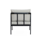 Back view of a cushioned chair with a black metal frame, light gray fabric, and waterproof cushions. Perfectly complements an outdoor armchair set for a stylish patio setup.