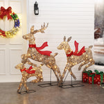 Majestic-Reindeer-family-running-decorations-with-charming-red-bows-perfect-for-outdoors