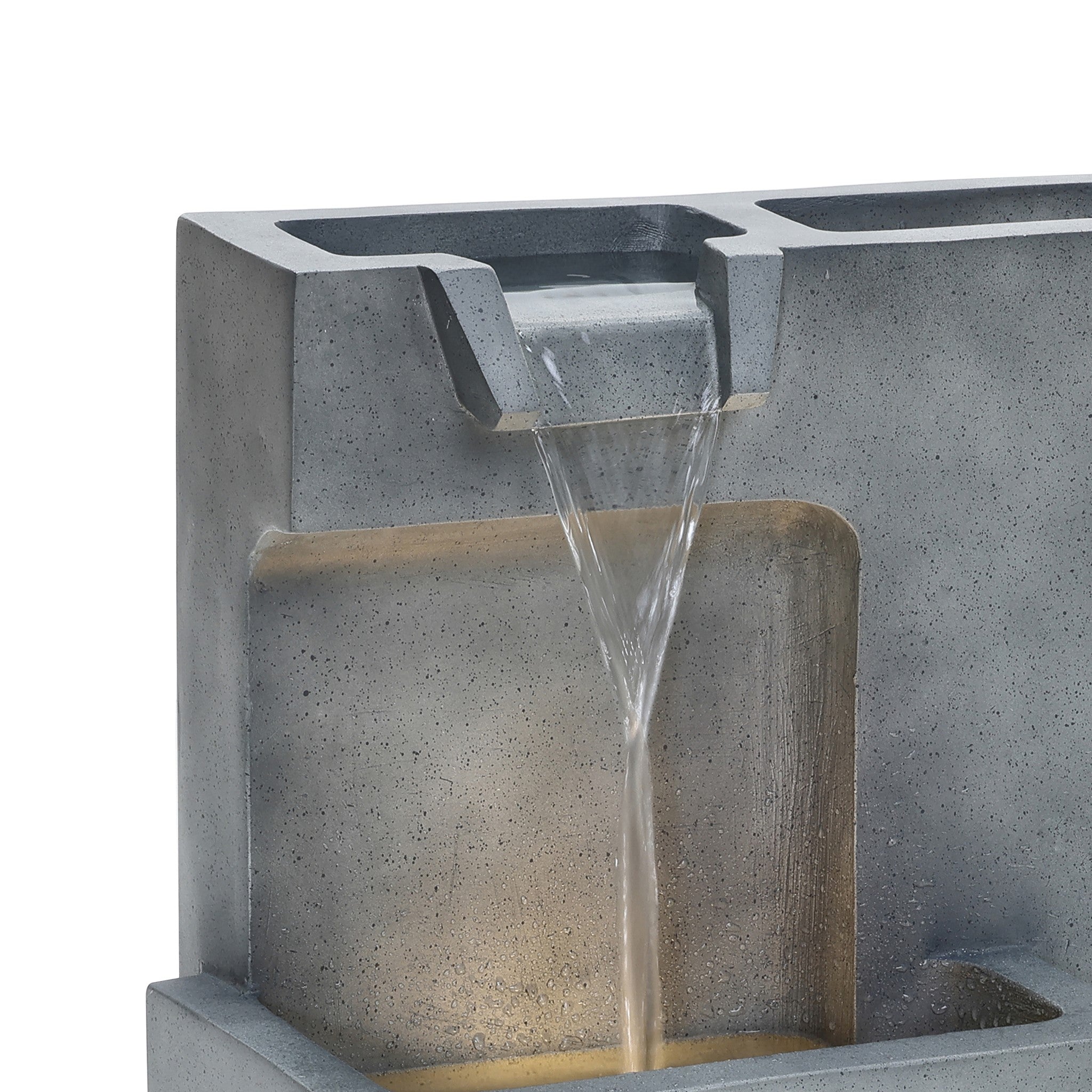 This modern minimalist fountain boasts a sleek concrete design with a rectangular base and tiered sections. Water cascades elegantly from the top into the lower basin, providing an ideal centerpiece for outdoor relaxation.