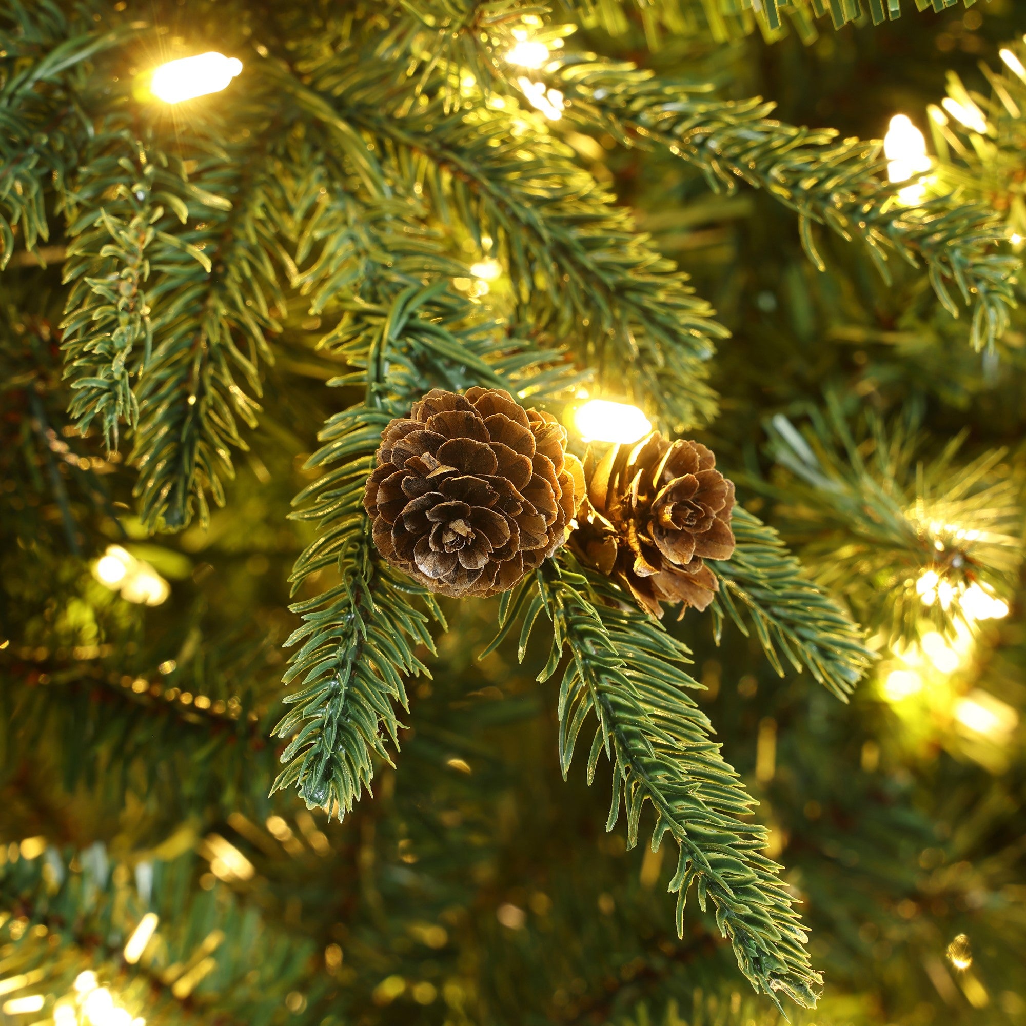 green-slender-artificial-christmas-tree-with-pine-cones