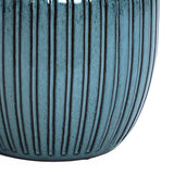 Close-up of a sea-green flowerpot with vertical ridges, crafted from high-quality materials.