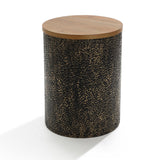 Cylindrical side table featuring a hammered iron base with a speckled dark texture and topped with smooth fir veneer.