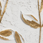 White textured surface with a sophisticated gold leaf motif in a botanical pattern, creating an exquisite high-end art piece.