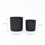 Two black cylindrical planters, perfect for outdoor use: the left one measures 13.98 inches tall and 13.62 inches in diameter, while the right one is 11.02 inches tall and equally wide. Both are crafted to be durable, ensuring they stand the test of time in any environment.