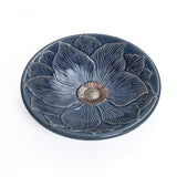 Blue ceramic birdbath with petals and vines pattern