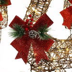 Christmas-Reindeer-Decorations-with-red-bow-pinecones-and-red-berries