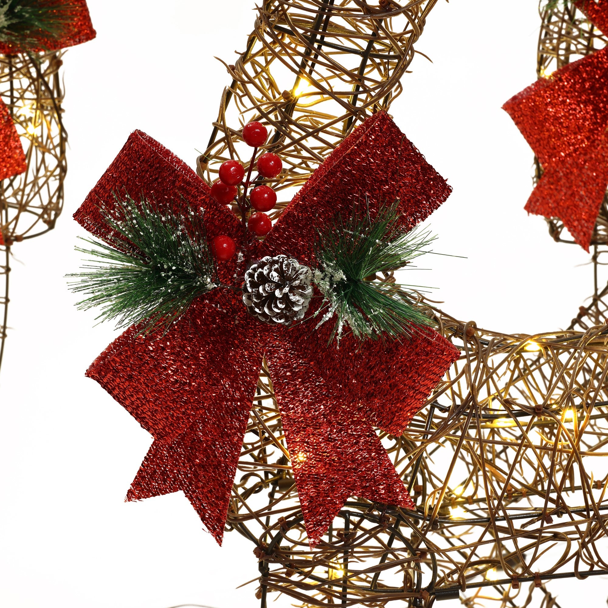 Christmas-Reindeer-Decorations-with-red-bow-pinecones-and-red-berries