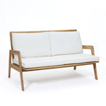 white-loveseat-with-a-wooden-frame-and-white-cushions 