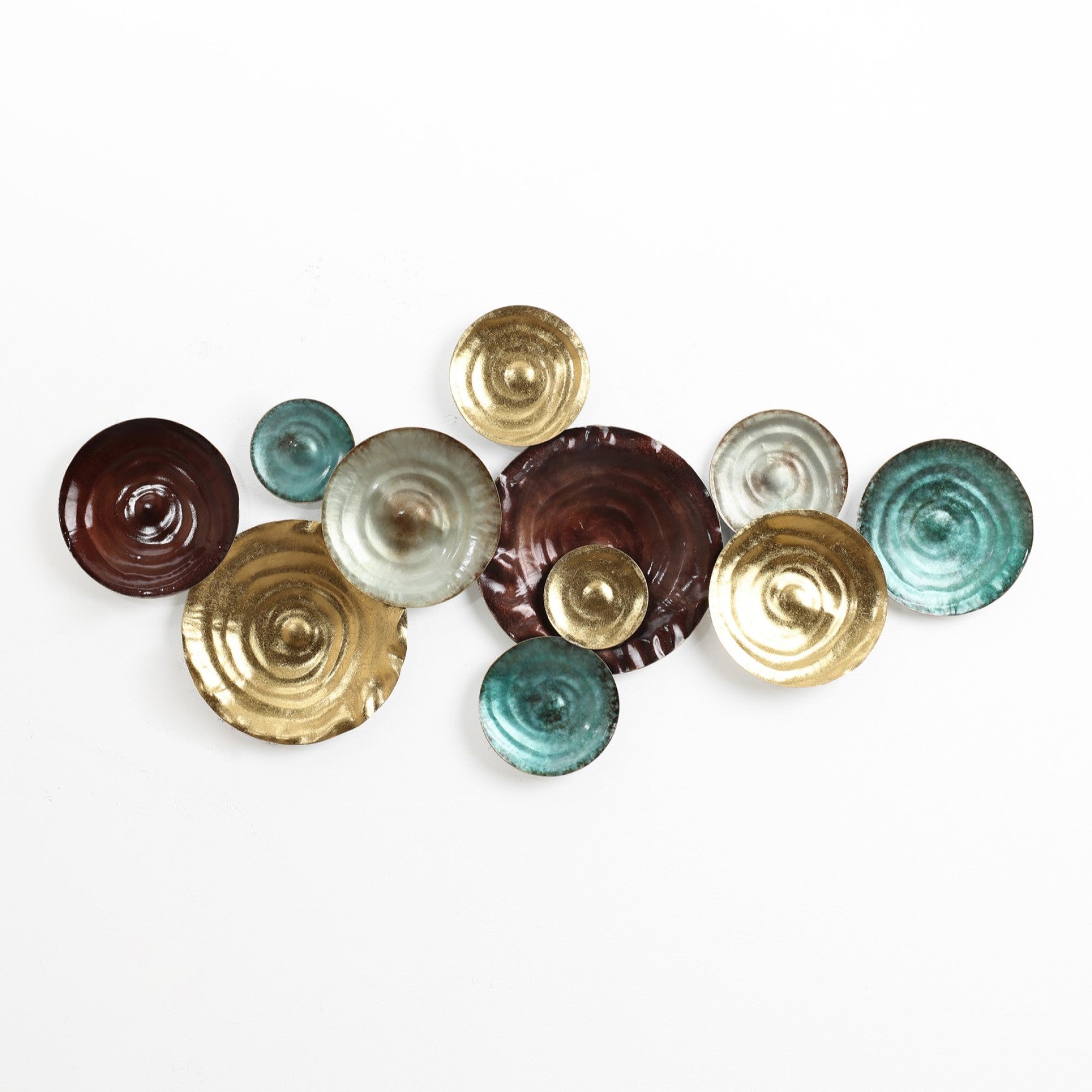 Wall art featuring an abstract design of overlapping circular metallic plates in shades of brown, gold, silver, and teal elegantly arranged against a white background. This metal wall art piece adds a sophisticated touch to any wall decoration.