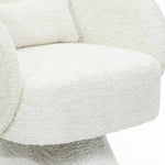 white-upholstered-chair-with-a-curved-back-and-seat-covered-in-white-fabric