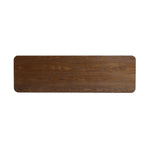 A long, rectangular wooden tabletop with rounded corners showcases a natural wood grain pattern, embodying the essence of minimalist design.