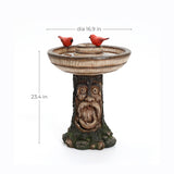 Polyresin garden birdbath with a tree trunk base featuring a face, this outdoor decor centerpiece stands 23.4 inches tall and 16.9 inches in diameter, adorned with two red birds on the rim for added charm.