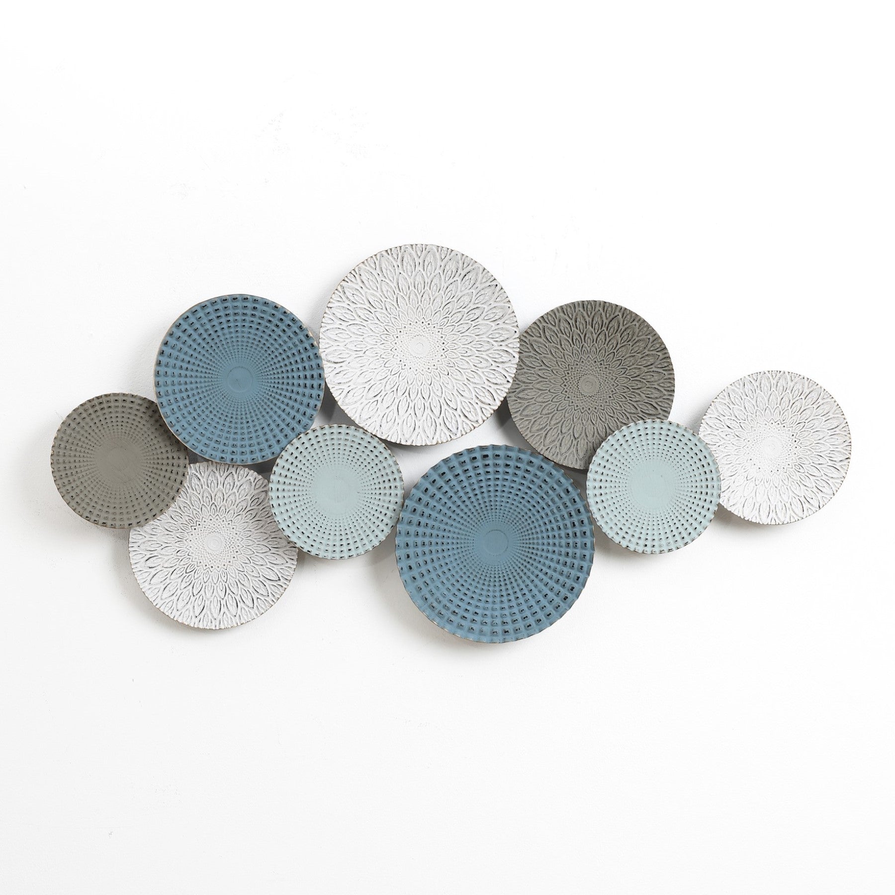 Abstract metal wall decoration featuring nine overlapping decorative plates in shades of blue and gray with intricate circular patterns, adding an artistic touch to your home decor.