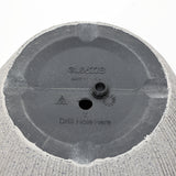 The bottom of a gray, concrete-textured planter features a Drill Hole Here label, along with a manufacturing mark and Made in China. Perfect for those seeking weather-resistant planters that promise durability in any season.