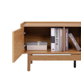 The Eric oak finish 70 TV stand by LuxenHome, designed for TVs up to 75, is styled as a wooden cabinet featuring open doors that reveal stacked books and a closed decorative box, with its simple, modern design reminiscent of mid-century consoles and some book titles visible on the shelf.