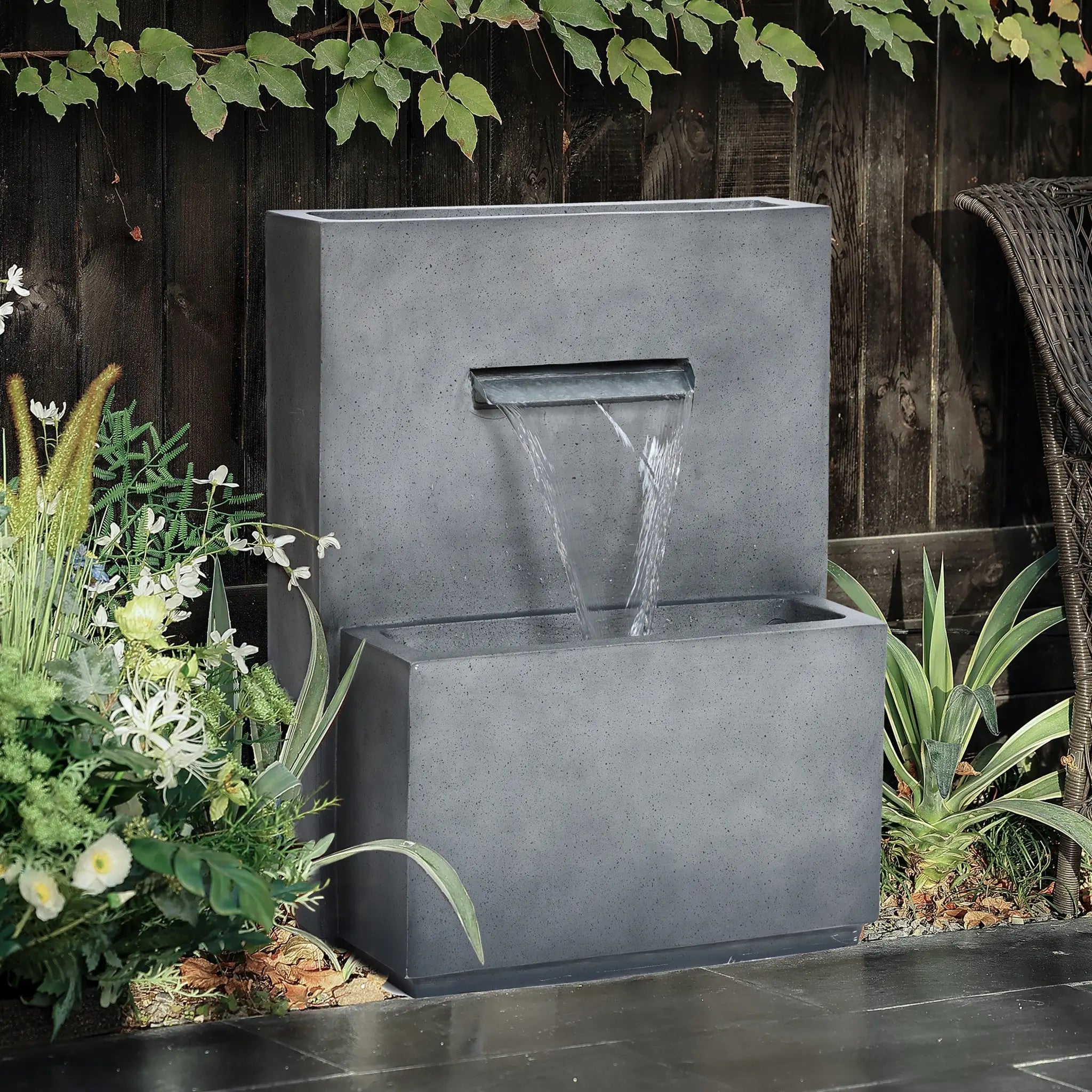 outdoor waterfall fountain with planter
