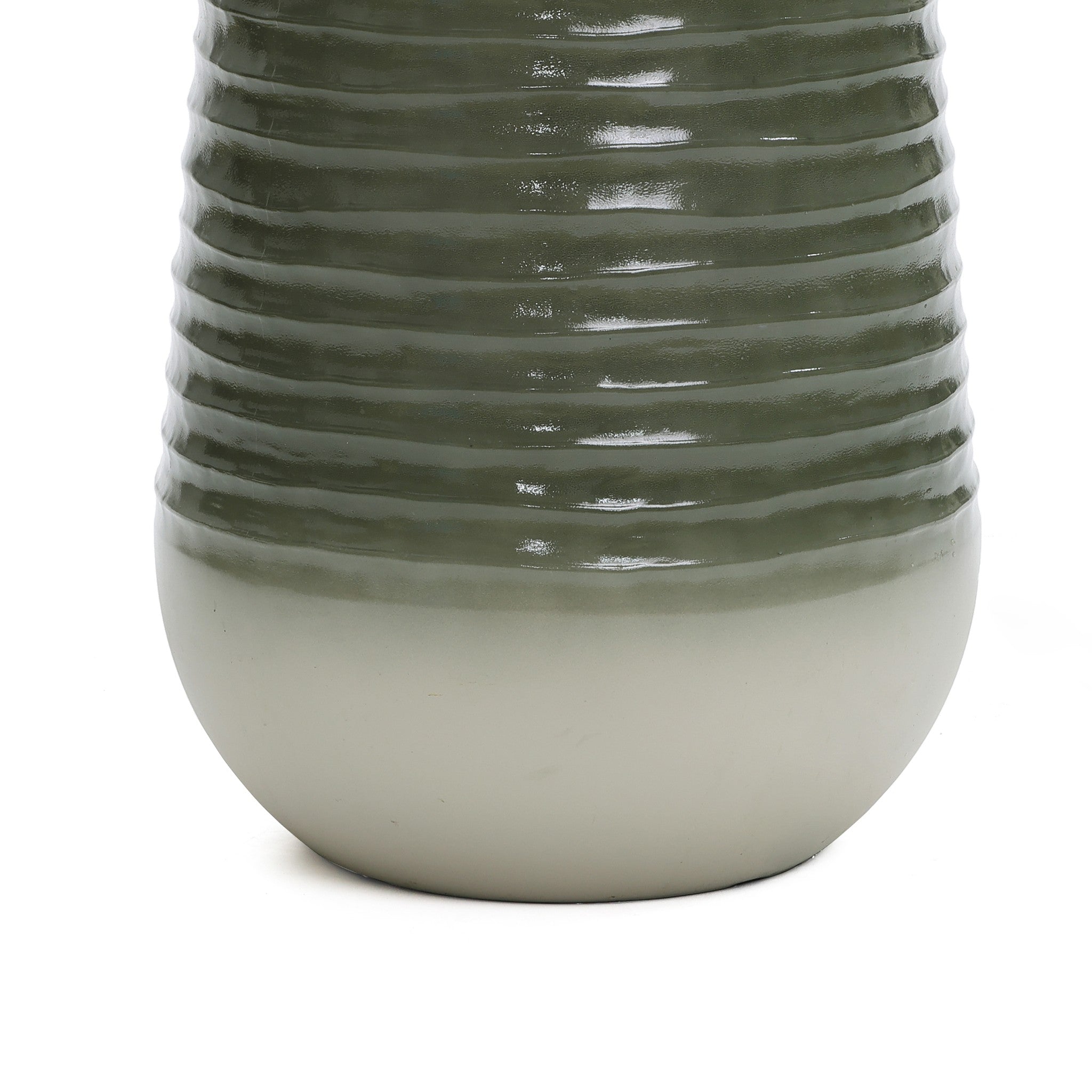 Close-up of a ceramic vase featuring a ribbed design on its dark green top and a smooth light gray bottom.