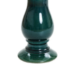 A green ceramic vase with a glossy finish, featuring a bulbous body and a wide, round base, perfect for complementing your outdoor space.