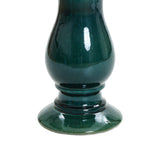 A green ceramic vase with a glossy finish, featuring a bulbous body and a wide, round base, perfect for complementing your outdoor space.