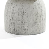 A close-up of a textured, light gray cylindrical surface with speckles and aged details. The Rustic off White and Gray Outdoor Side Table, 15.75 h, highlights material irregularities and casts a soft shadow on the white backdrop.