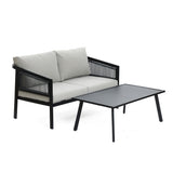 A stylish black steel-framed outdoor loveseat with light gray cushions is paired with a matching rectangular black coffee table, creating a cohesive and modern outdoor setting.