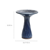 Blue ceramic birdbath with leaves and swirl pattern