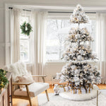 artificial-flocked-led-christmas-tree-stands-by-the-window