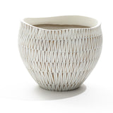 The LuxenHome White textured resin round planter, large, features an irregular rim and a geometric pattern with vertical elongated designs, creating a modern aesthetic against its plain white background.