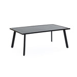 A rectangular black table with a minimalist design and four angled legs, crafted from sleek black steel, set against a white background.