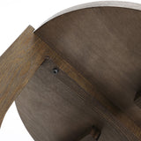 Close-up of a mid-century modern side tables underside, revealing a leg attachment with a bolt and washer. The wood has a natural brown finish that complements the sleek design, reminiscent of classic walnut veneer tables.
