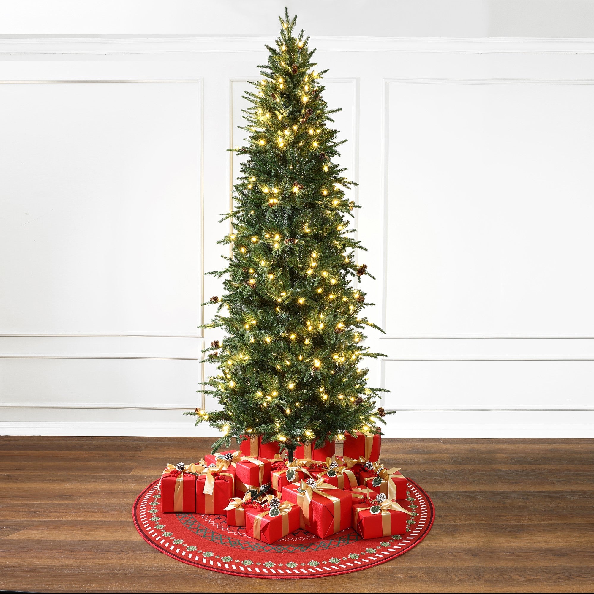 slender-artificial-christmas-tree-with-pine-cones-on-the-ground-with-gift-box