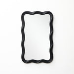 Modern wall mirror featuring a black, wavy, scalloped frame, mounted on a plain white wall.