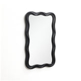 Modern wall mirror featuring a wavy black frame, elegantly mounted on a white wall.