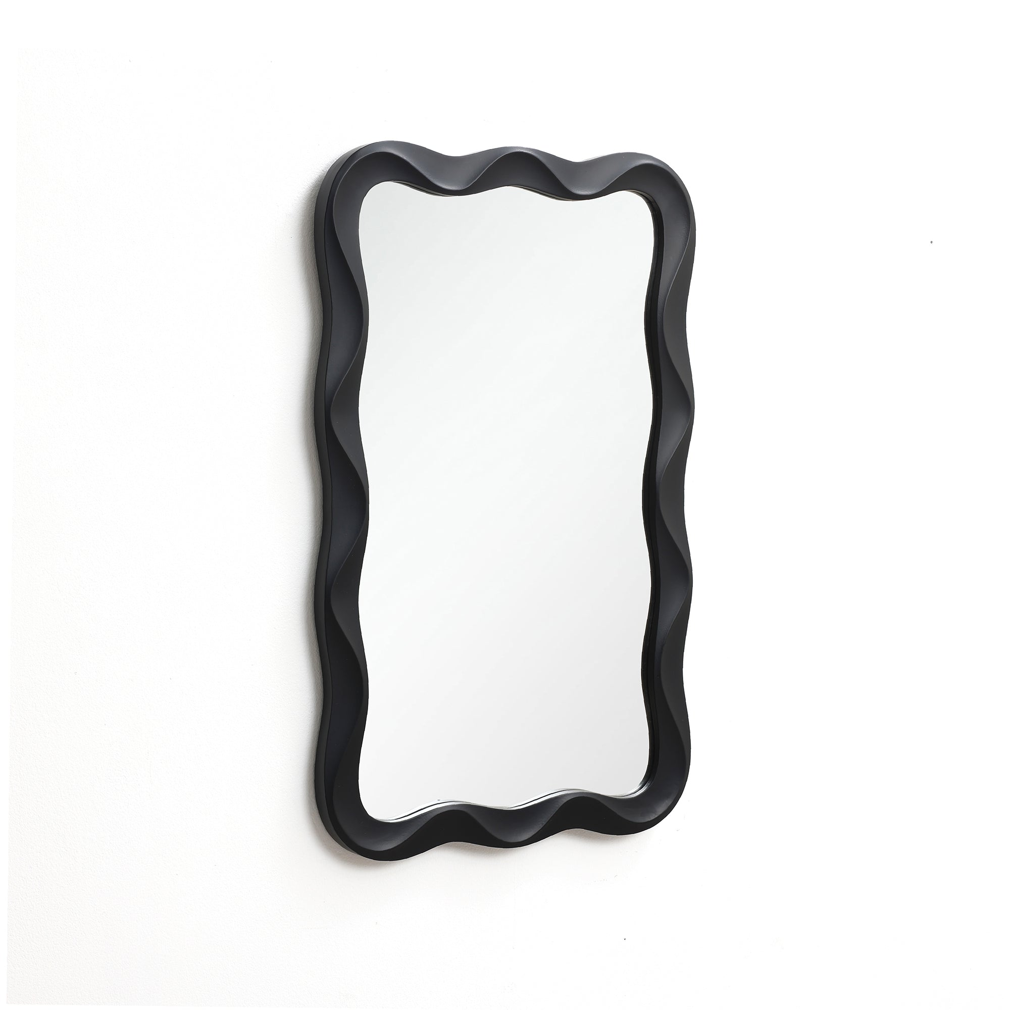 Modern wall mirror featuring a wavy black frame, elegantly mounted on a white wall.