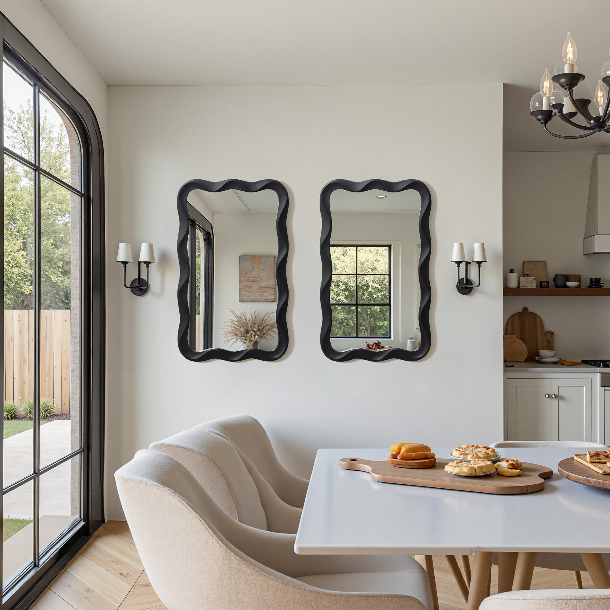 Two striking wavy frame mirrors on the wall. Enhancing the bright, contemporary space.