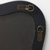 Close-up of the back, showing two brass hanging brackets attached with screws to a dark backing material.