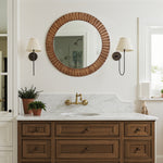 A bathroom vanity with a round wall mirror with an oak wood frame. Add a touch of eclent.