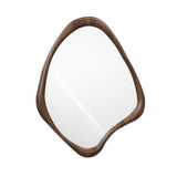 Irregularly shaped wall mirror with a wooden frame, exuding Scandinavian charm, on a white background.