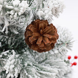 artificial-christmas-tree-with-pine-cones-berries-and-metal-pot