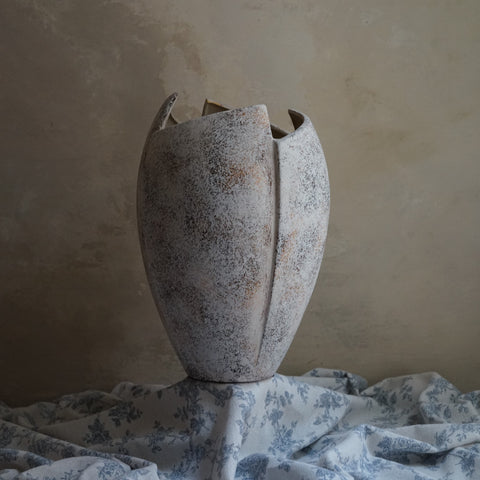cracked open antique marble-like finish terracotta vase