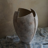 cracked open antique marble-like finish terracotta vase