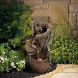 water-fountain-and-a-pot-in-a-garden-setting